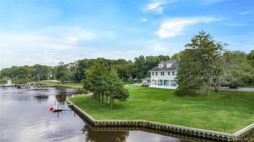 Set down a 600' tree-lined drive, this private 4.83-acre - Beach Home for sale in Quogue, New York on Beachhouse.com