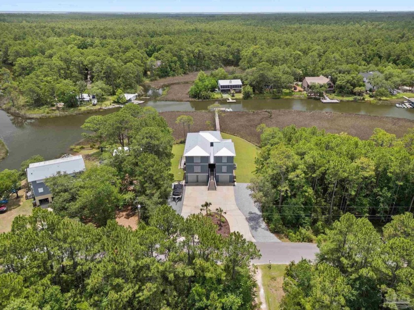 Experience effortless waterfront living in this custom - Beach Home for sale in Milton, Florida on Beachhouse.com