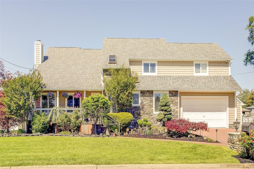 Welcome to Your Dream Waterfront Home! Nestled in a charming and - Beach Home for sale in Massapequa, New York on Beachhouse.com