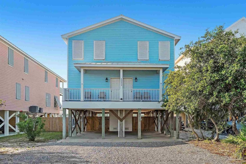 Welcome to The Sandy Fox, a rare Lagoon-front duplex offering a - Beach Townhome/Townhouse for sale in Gulf Shores, Alabama on Beachhouse.com