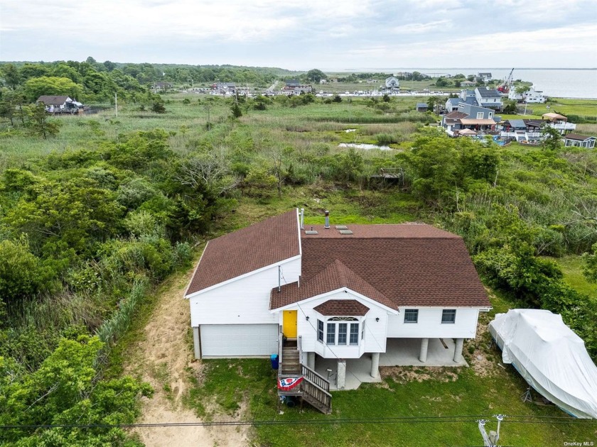 Welcome to 63 Beaver Drive in Mastic Beach, a stunning elevated - Beach Home for sale in Mastic Beach, New York on Beachhouse.com