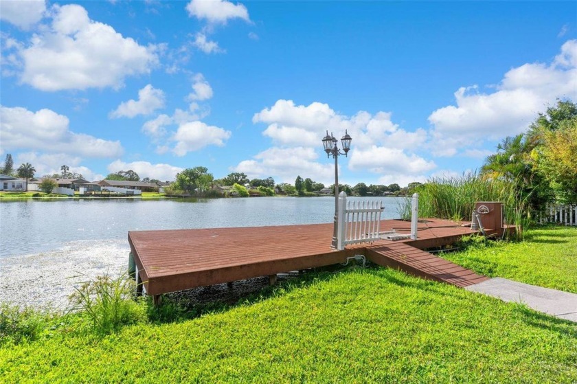 Live the Florida waterfront lifestyle in this 4-bedroom, 2-bath - Beach Home for sale in Tampa, Florida on Beachhouse.com