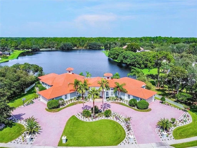 Welcome to this stunning lakefront estate on nearly an acre of - Beach Home for sale in Spring Hill, Florida on Beachhouse.com