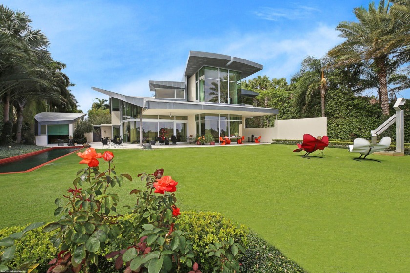 Step into the epitome of luxury living with this stunning Frank - Beach Home for sale in Jupiter, Florida on Beachhouse.com