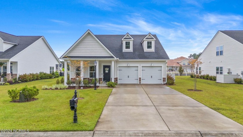 Discover coastal living at its finest in this nearly new home at - Beach Home for sale in Calabash, North Carolina on Beachhouse.com