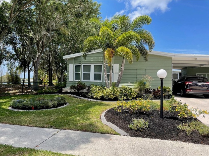 Imagine enjoying the serene beauty of a calm lake, just outside - Beach Home for sale in Palmetto, Florida on Beachhouse.com