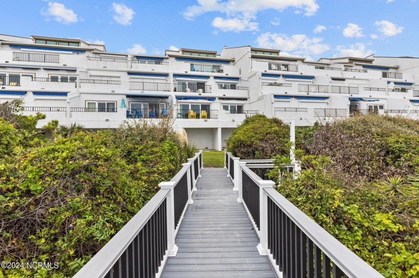 This exclusive oceanfront condo in Bogue Shore Club, Unit 206 - Beach Condo for sale in Pine Knoll Shores, North Carolina on Beachhouse.com