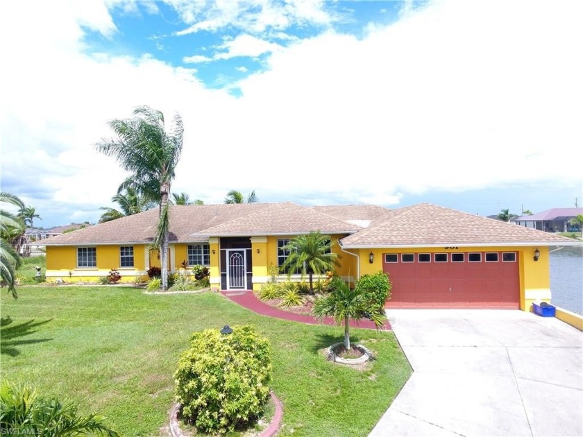 Stunning Waterfront Pool Home on Triple Oversized Lot in NW Cape - Beach Home for sale in Cape Coral, Florida on Beachhouse.com