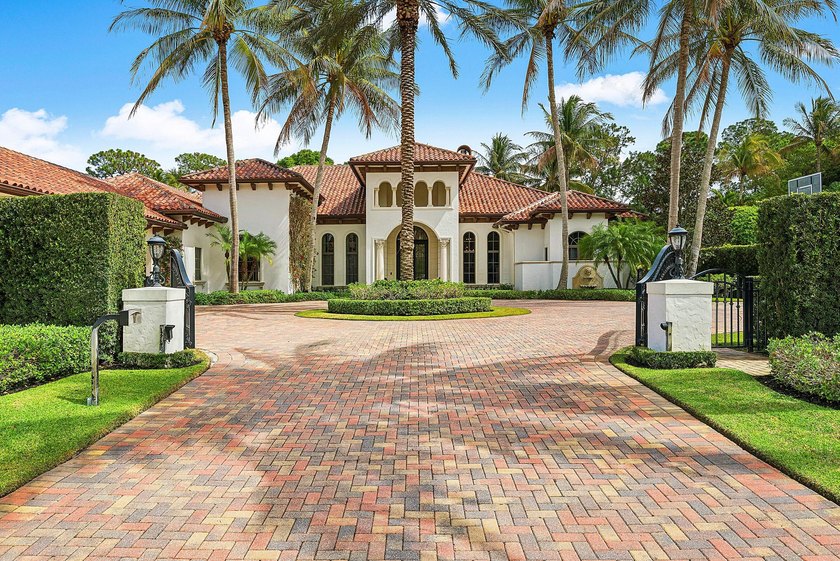 Located within the privately gated Flagler Estates, a rare - Beach Home for sale in West Palm Beach, Florida on Beachhouse.com
