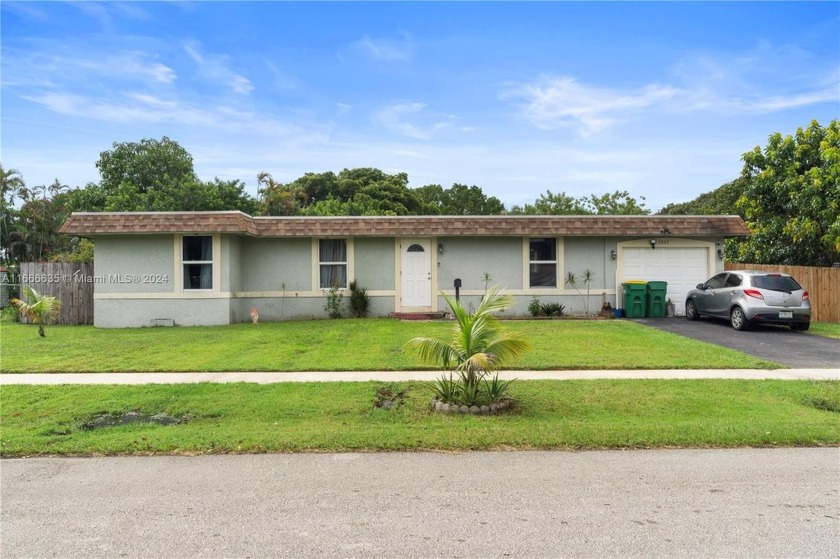 Discover this beautiful 3-bedroom, 2-bath home located on a - Beach Home for sale in Tamarac, Florida on Beachhouse.com