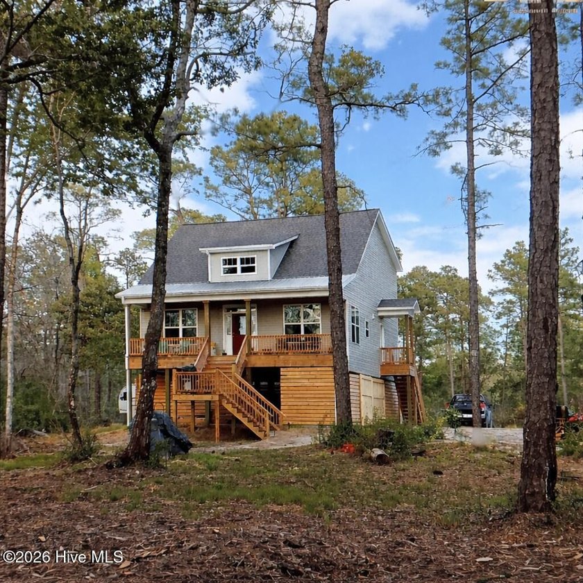 Nestled on approximately 13 scenic acres, this inviting - Beach Home for sale in New Bern, North Carolina on Beachhouse.com