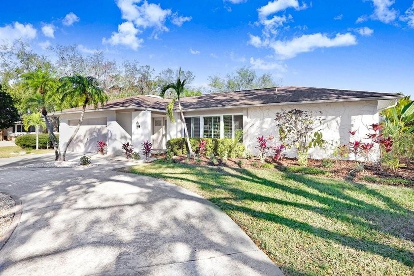 Nestled on a desirable corner lot in Feather Sound, this fully - Beach Home for sale in Clearwater, Florida on Beachhouse.com