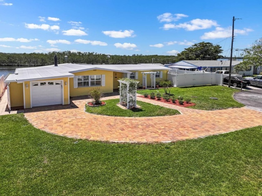 Idyllic 3 bed, 2 bath, WATERFRONT home with a NEW ROOF - Beach Home for sale in Ruskin, Florida on Beachhouse.com