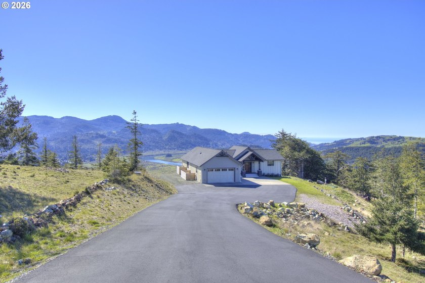 Perched above the Rogue River with stunning river and ocean - Beach Home for sale in Gold Beach, Oregon on Beachhouse.com