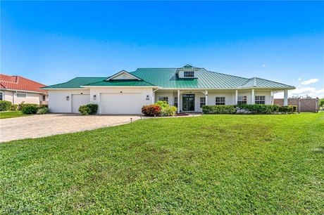 From The Moment You Pull Into The Wide Brick Paver Drive and - Beach Home for sale in Cape Coral, Florida on Beachhouse.com