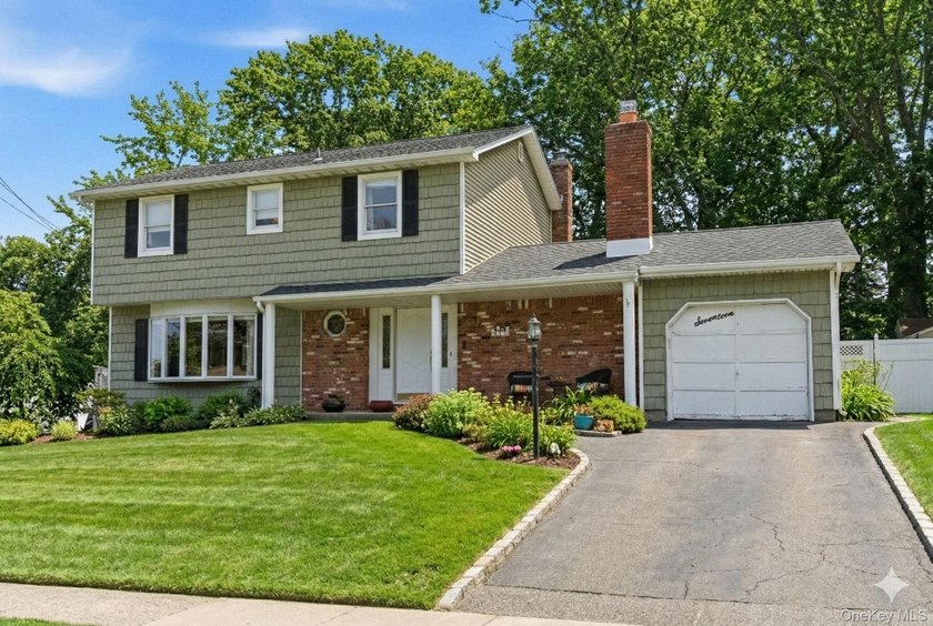 Bright and spacious 4-bedroom, 1.5-bath Colonial offering - Beach Home for sale in Rocky Point, New York on Beachhouse.com