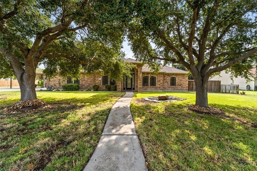 This 4-bedroom, 2.5-bath brick home with a 2-car garage sits on - Beach Home for sale in Corpus Christi, Texas on Beachhouse.com