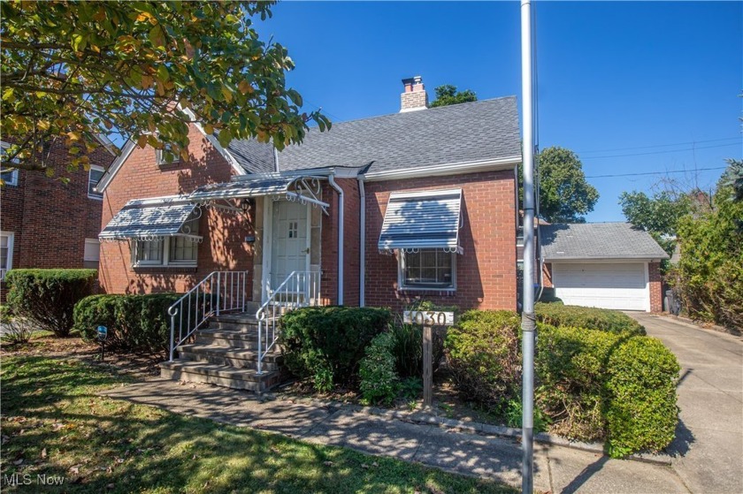 Welcome to this beautiful brick Cape Cod tucked away on a - Beach Home for sale in Cleveland, Ohio on Beachhouse.com