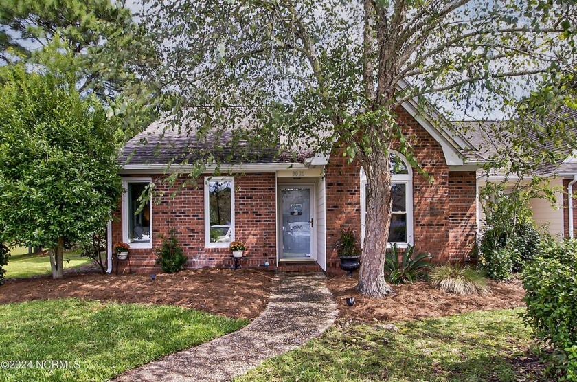 Welcome to this charming mostly brick exterior end-unit townhome - Beach Townhome/Townhouse for sale in Wilmington, North Carolina on Beachhouse.com