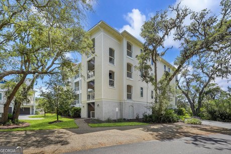 The view of Jekyll Harbor takes center stage in this 3 bedroom 3 - Beach Condo for sale in Jekyll Island, Georgia on Beachhouse.com