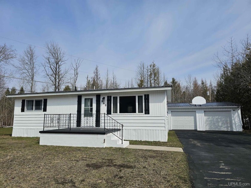 Sitting just steps from the sandy shores of Lake Michigan - Beach Home for sale in Manistique, Michigan on Beachhouse.com