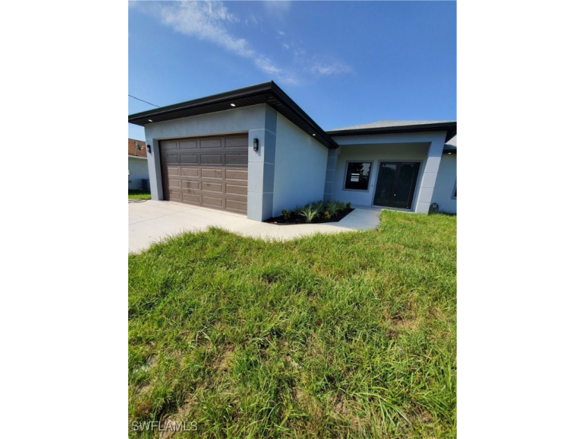 New Construction, beautiful property with lake view in a - Beach Home for sale in Lehigh Acres, Florida on Beachhouse.com