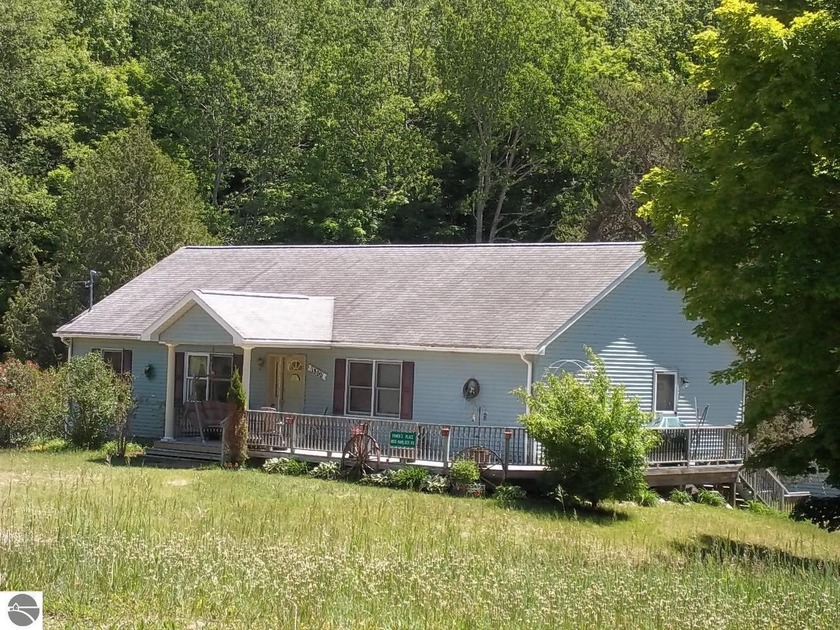 Perfect for the fixer-upper enthusiast! This 3-bedroom, 2-bath - Beach Home for sale in Cedar, Michigan on Beachhouse.com