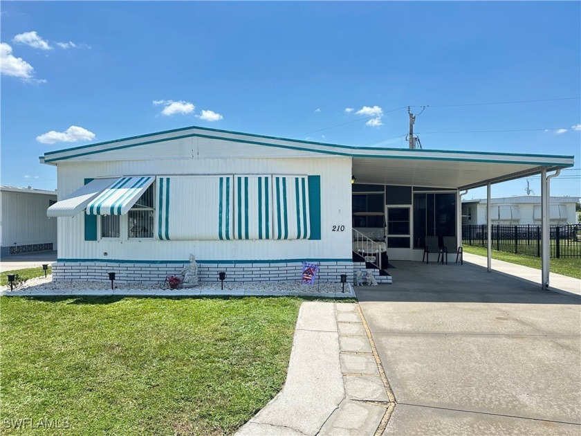 Charming 2 BR/2 BA Double-Wide Manufactured Home located in - Beach Home for sale in North Fort Myers, Florida on Beachhouse.com