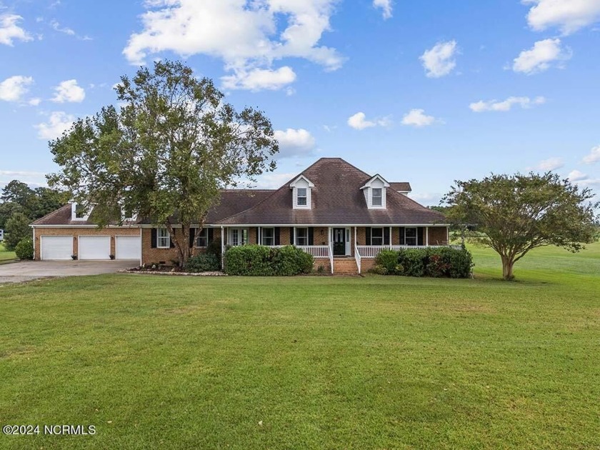 Welcome to this exquisite sprawling brick home nestled on a - Beach Home for sale in Knotts Island, North Carolina on Beachhouse.com