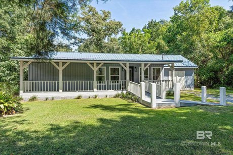 Welcome to this charming 2 bedroom, 2 bath home with an open - Beach Home for sale in Mobile, Alabama on Beachhouse.com