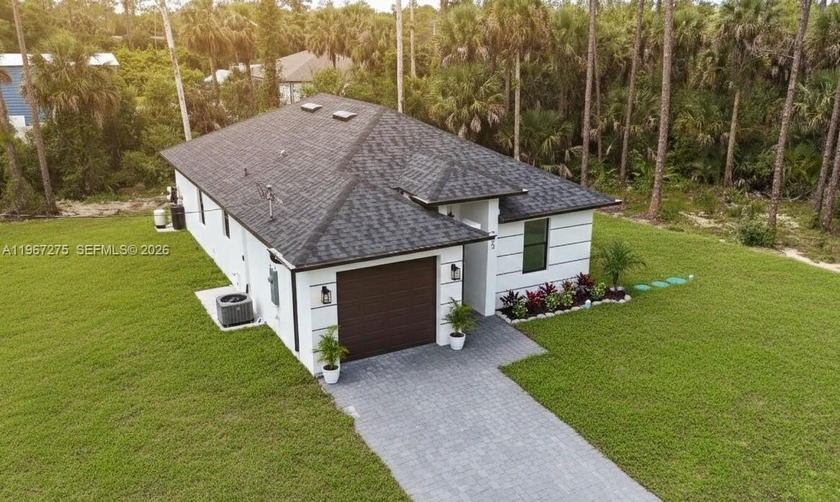 Experience the perfect blend of modern luxury and total peace of - Beach Home for sale in Lehigh Acres, Florida on Beachhouse.com