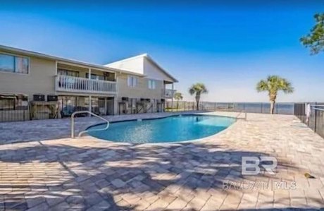 Boat Slip, Pier, Bay Front Pool, End Unit Condo on Canal Road - Beach Home for sale in Orange Beach, Alabama on Beachhouse.com