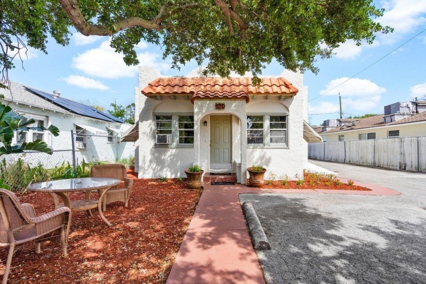 Location location location! This darling Spanish Style Lake - Beach Home for sale in Lake Worth Beach, Florida on Beachhouse.com