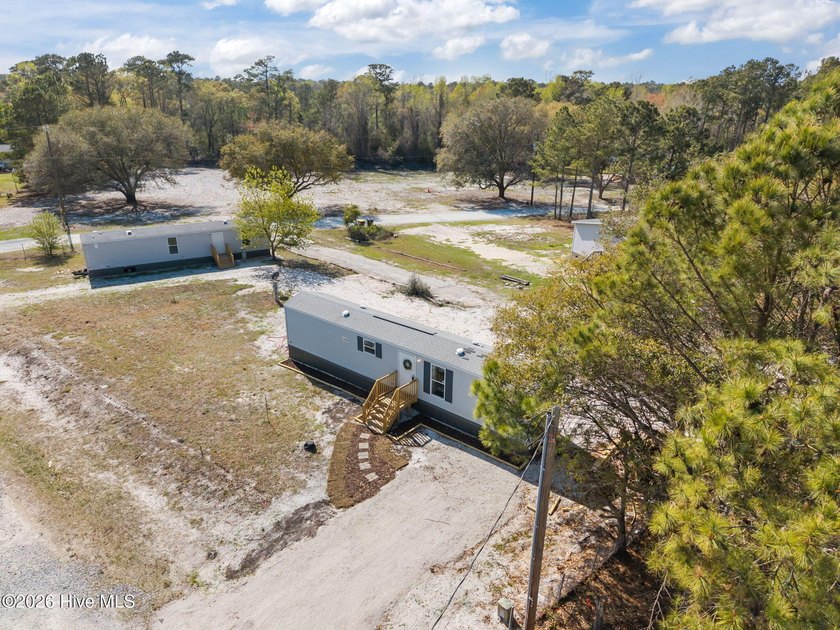 This property is an investor's dream! Situated on a unique - Beach Home for sale in Holly Ridge, North Carolina on Beachhouse.com