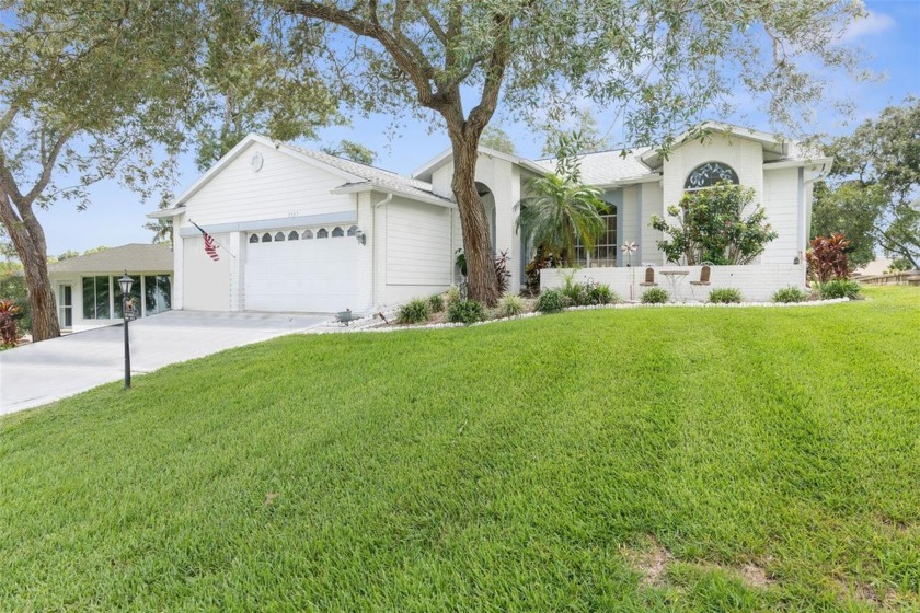 Welcome to this 3 Bedroom, 2 Bathroom, 3 Car Garage Nestled on - Beach Home for sale in Spring Hill, Florida on Beachhouse.com