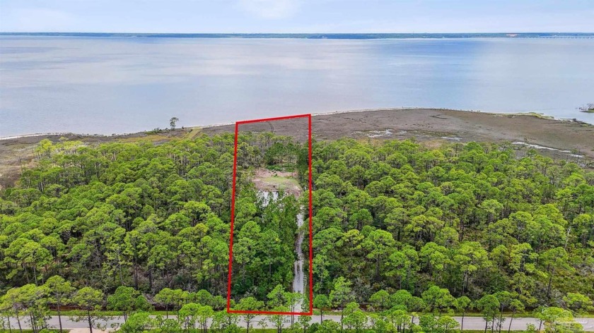 Discover your slice of paradise on this serene 2.63-acre - Beach Acreage for sale in Milton, Florida on Beachhouse.com