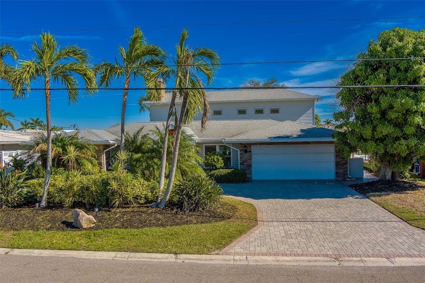 Indulge in Coastal Opulence at 207 Midway Island! Prepare to be - Beach Home for sale in Clearwater Beach, Florida on Beachhouse.com