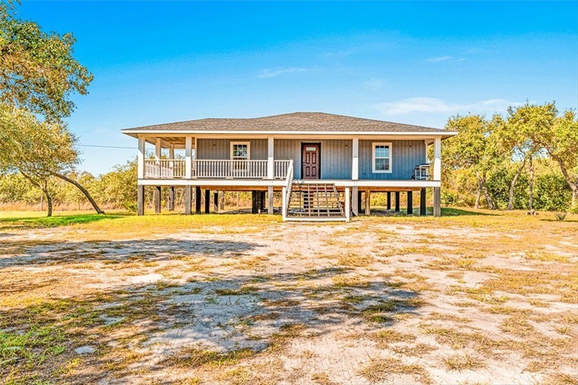 WELCOME HOME! Tucked in among graceful live oak trees, this - Beach Home for sale in Rockport, Texas on Beachhouse.com