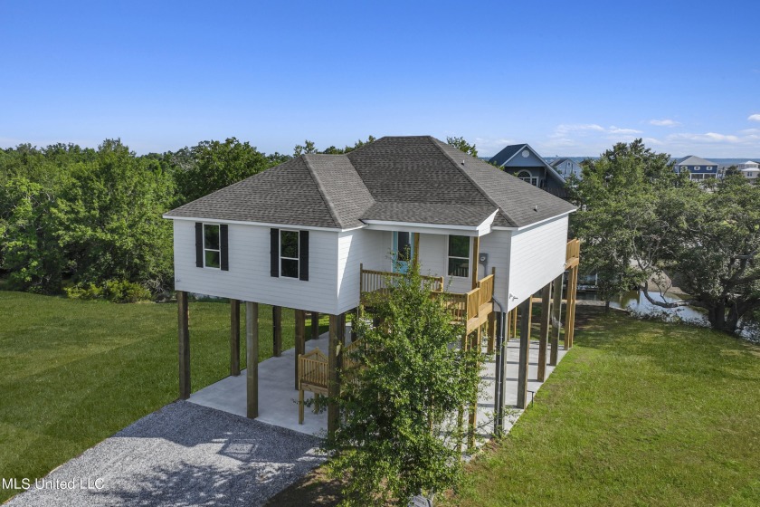 Absolutely gorgeous new WATERFRONT home on the Bayou AND IN THE - Beach Home for sale in Bay Saint Louis, Mississippi on Beachhouse.com