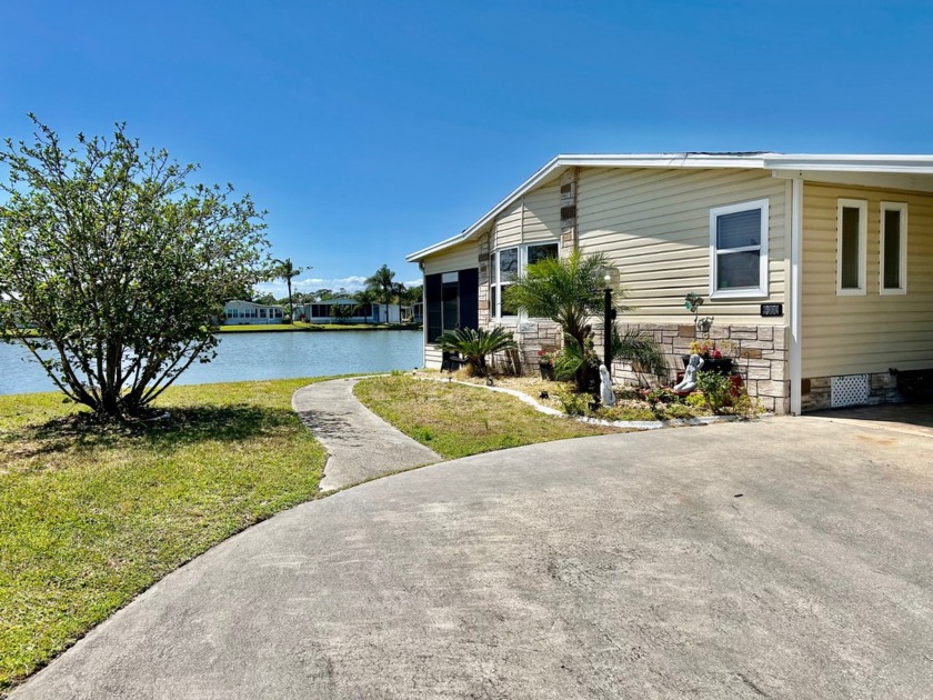 Experience the epitome of lakeside living in this stunning home - Beach Home for sale in Melbourne, Florida on Beachhouse.com