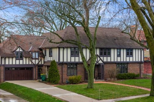 Embrace luxury living in this exquisite Tudor nestled in the - Beach Home for sale in Shorewood, Wisconsin on Beachhouse.com