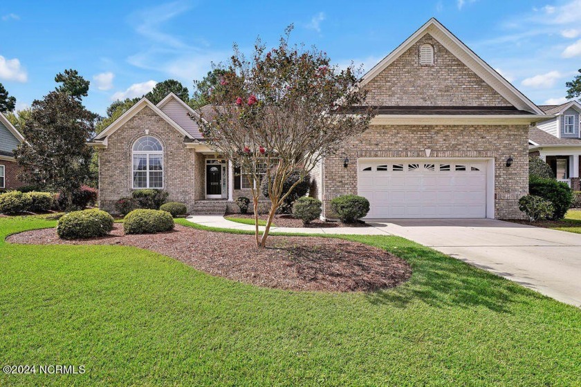 Situated on a beautiful, park-like, golf course lot with water - Beach Home for sale in Leland, North Carolina on Beachhouse.com