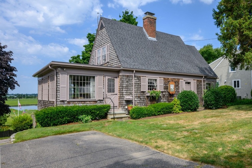 This delightful WATER FRONT Cape with almost 3/4 of an acre of - Beach Home for sale in Quincy, Massachusetts on Beachhouse.com