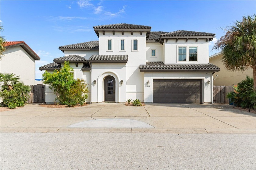 Nestled among palms on Island Moorings' coveted *Shady Side,* - Beach Home for sale in Port Aransas, Texas on Beachhouse.com