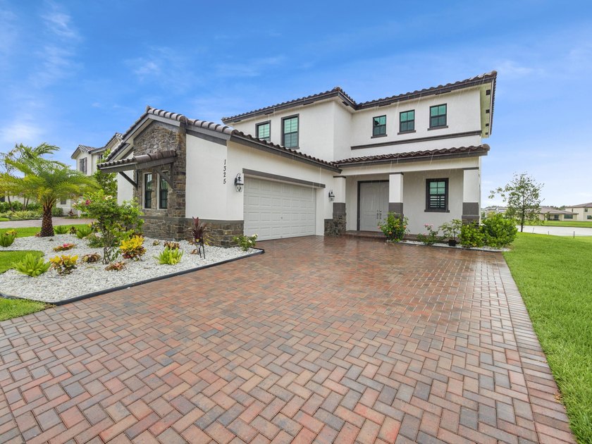 Nestled in the heart of Royal Palm Beach, this beautifully - Beach Home for sale in Royal Palm Beach, Florida on Beachhouse.com