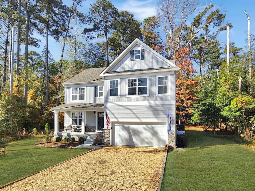 This charming 4-bedroom, 2.5-bathroom home in Captains Cove - Beach Home for sale in Greenbackville, Virginia on Beachhouse.com