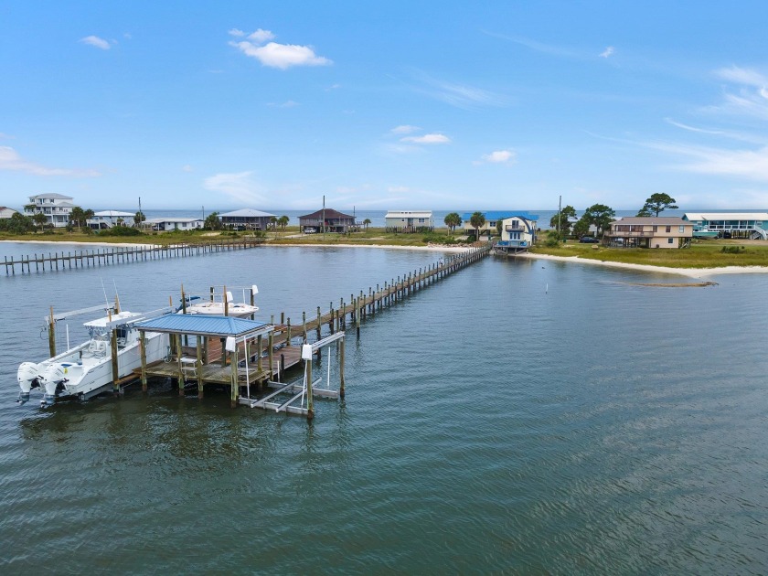 This charming bay front cottage boasts stunning bay views from - Beach Home for sale in Alligator Point, Florida on Beachhouse.com