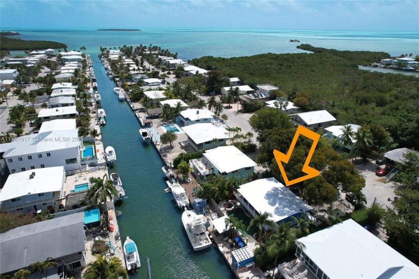 Fisherman's Delights! This concrete fortress is nestled in a - Beach Home for sale in Plantation Key, Florida on Beachhouse.com