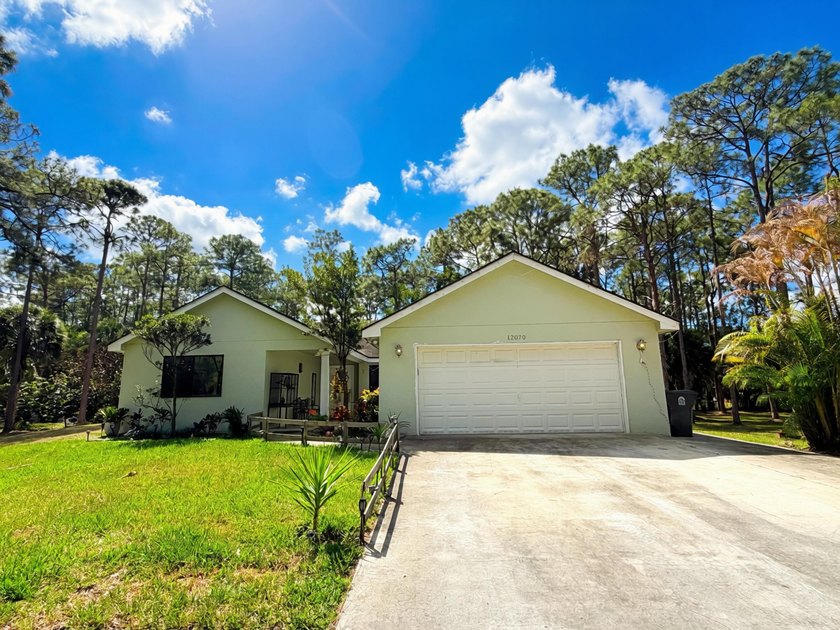 Welcome to your private oasis in The Acreage! This property - Beach Home for sale in West Palm Beach, Florida on Beachhouse.com