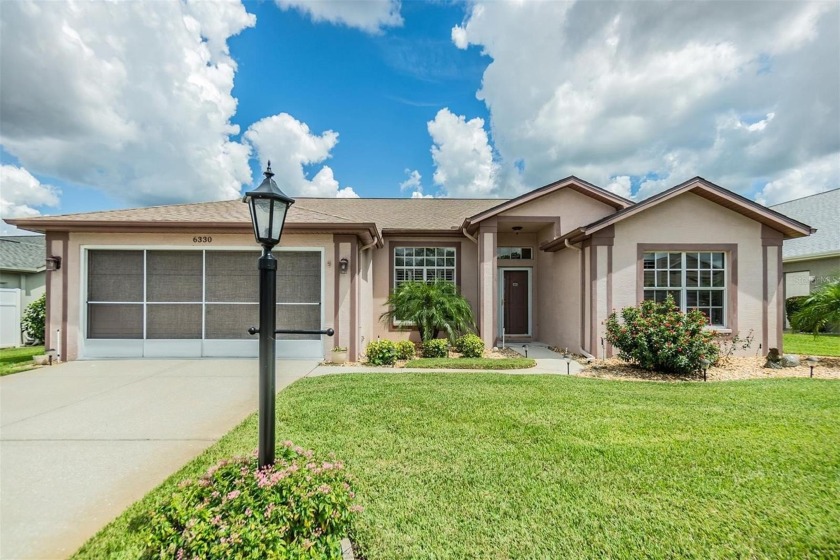 BEAUTIFUL 3 BEDROOM, 2 BATHROOM HOME WITH SPACIOUS ENCLOSED - Beach Home for sale in New Port Richey, Florida on Beachhouse.com